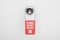 Please do no disturb sign on handle with lock on white background