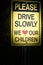 Please drive slowly we love our children Sign