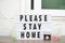 Please stay home. Text in light box in stay home stay safe, anti coronavirus concept