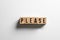 ` please ` text made of wooden cube on  White background