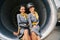 Pleased air hostesses sitting in the turbofan engine