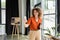 pleased businesswoman with curly hair holding