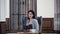 pleased businesswoman holding menu in lobby