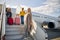 Pleased mom with her children boarding the plane