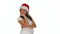 Pleased young girl in a Christmas Santa hat