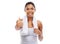 Pleased with your workout progress. A gorgeous young woman in sportswear giving you the thumbs up.