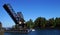 Pleasure boat cruises towards railroad bridge