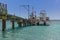 A pleasure boat moored by a jetty on Carlisle beach in Bridgetown, Barbados