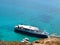 A pleasure boat in a picturesque bay on the Mediterranean Sea, top view. Bay Balos near the Greek island Gramvous.