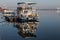 Pleasure boat and a river pier afloat