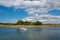 Pleasure boat sailing by island of Dybso on the Danish countryside