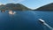 Pleasure boat sails along the Bay of Kotor to the island of Gospa od Skrpjela