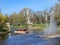 Pleasure boat with tourists cruise along the Riga river canal on background the Freedom Monument