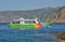 Pleasure boat with tourists near the Corsican shore