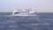 Pleasure Boat with Tourists is Sailing in the Storm Sea. Egypt, Sharm El Sheikh