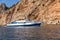 Pleasure craft against a rocky shore.