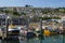 Pleasure craft and fishing boats, in Newlyn Harbour Cornwall, England