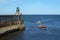 Pleasure and fishing boats entering Whitby harbour.