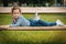 Pleasure little girl lying on bench