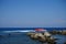 A pleasure motor boat carries tourists off the coast of the city of Rhodes, Greece