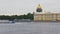 Pleasure ship is floating on Neva river near shore with view on buildings
