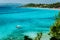 Pleasure white boat in crystal clear blue sea water. Spectacular Platis Gialos and Makris Gialos Beach, Kefalonia island