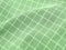 Pleated checkered green fabric