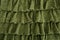 Pleated skirt fabric fashion in green closeup