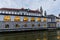 Plecnik arcade market building reflecting in Ljubljanica river in Ljubljana, Sloven