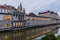 Plecnik arcade market building reflecting in Ljubljanica river in Ljubljana, Sloven