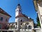 Plecnik stairs, fountain and arches and a church behind in Kranj