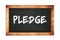 PLEDGE text written on wooden frame school blackboard