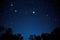 the pleiades star cluster in a clear night sky