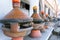 Plenty of clay tagine pots on portable clay barbeque
