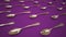 Plenty of metal spoons lined up on purple surface