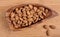 Plenty of ripe hazelnuts in bowl healthy edible organic hazel nuts on kitchen table top view