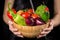 Plenty of wet vegetables in wooden dish on woman hands