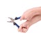 Pliers in the hand of a girl. Symbol of hard work, feminism and labor day. Isolate on white background