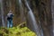 PLITVICE, CROATIA - MAY 24, 2019: Photographer at Veliki Slap waterfall Plitvice Lakes National Park, Croat