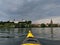 Ploen, Germany, yellow kayak on great ploner ploener lake in background plon castle, dark sky with d