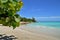 Plot of the beach, coastline of the Caribbean Sea, beautiful azure sea, green tropical vegetation, against the blue sky