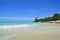 Plot of the beach, coastline of the Caribbean Sea, beautiful azure sea, green tropical vegetation, against the blue sky