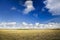 Plough plowed brown clay soil field