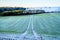 Ploughed field covered in frost in The South Downs national Park, United Kingdom