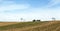 Ploughed field with tractor and liquid manure spreader