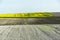 Ploughed fields and rapeseed