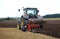 Ploughing tractor at field cultivation work, Lithuania