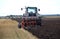 Ploughing tractor at field cultivation work, Lithuania