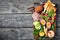 Ploughman`s lunch on an old wooden tray