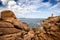 Ploumanac`h Mean Ruz lighthouse between the rocks in pink granite coast, Perros Guirec, Brittany, France.